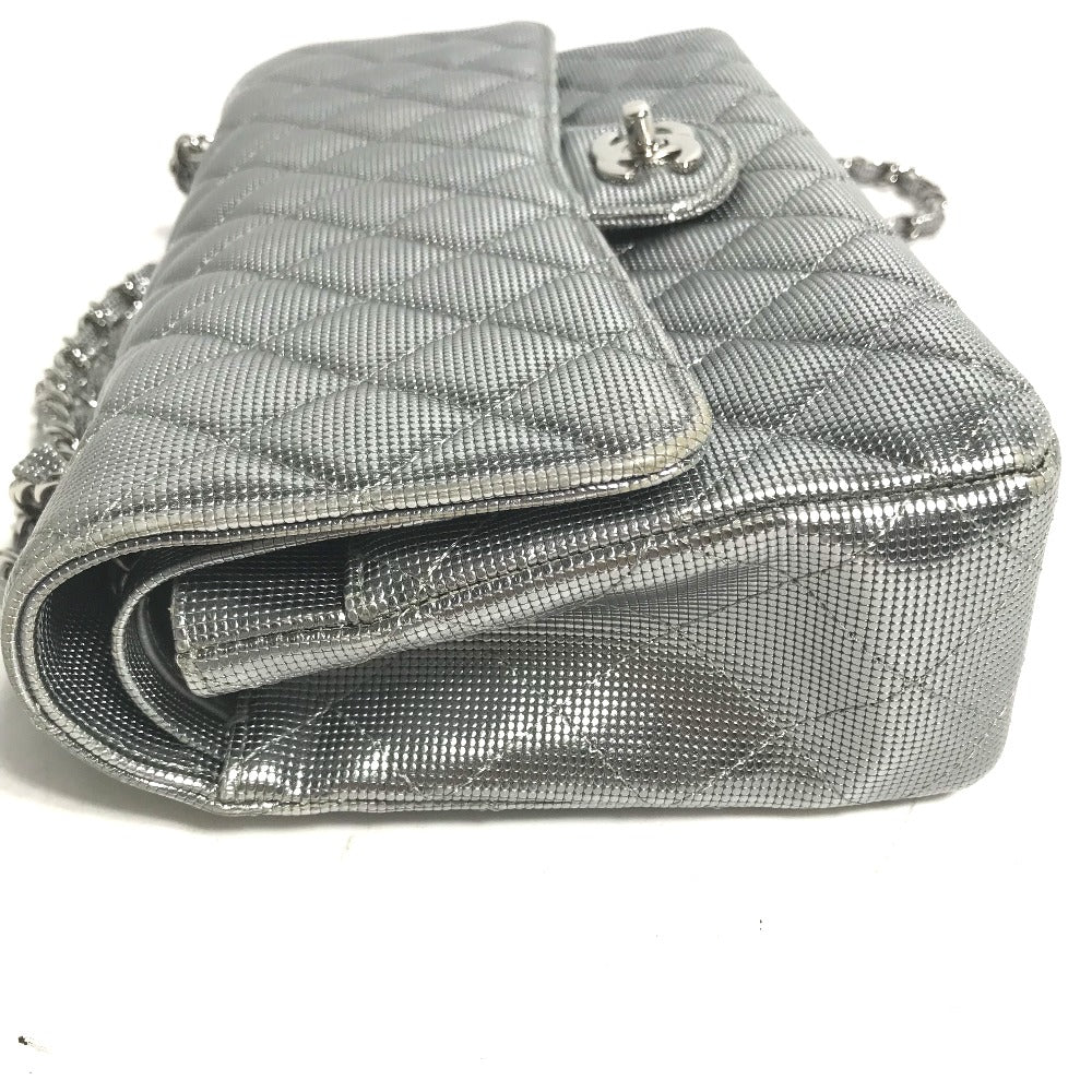 Silver quilted handbag with chain strap on a white background