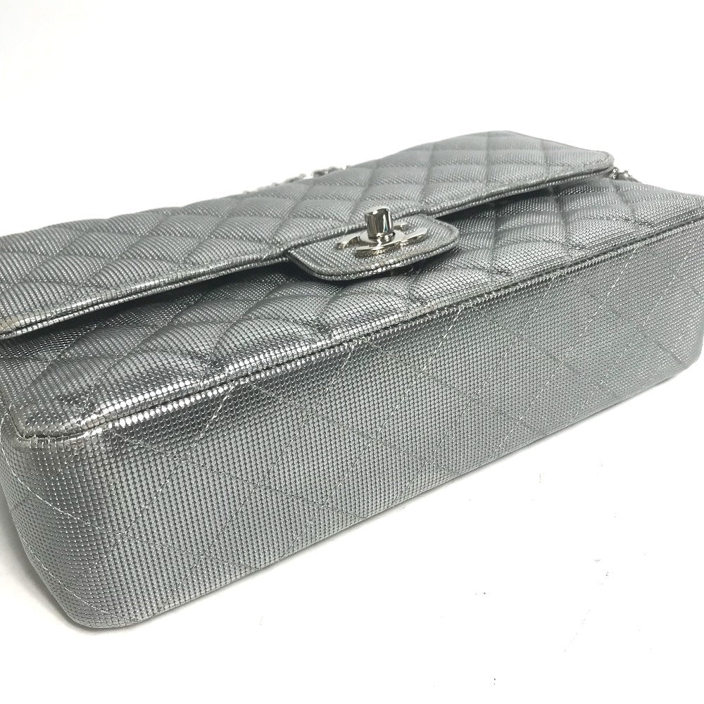 Silver quilted handbag on a white background