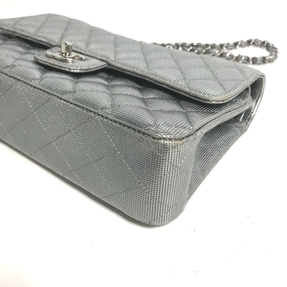 Silver quilted handbag with a chain strap on a white background