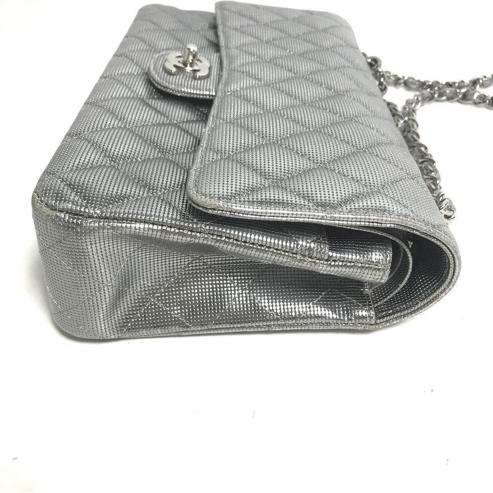 Silver quilted handbag with chain strap on a white background