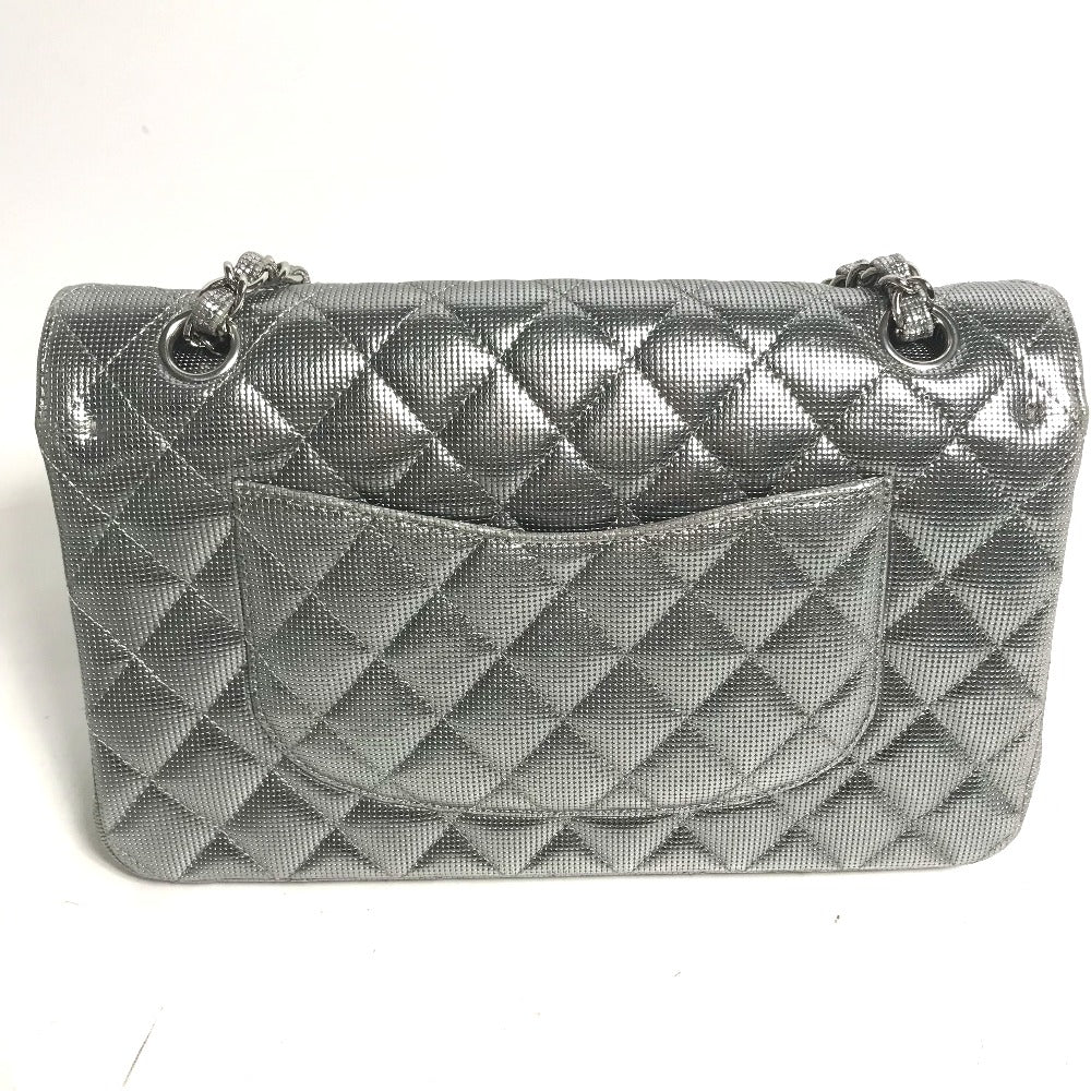 Silver quilted handbag on a white background
