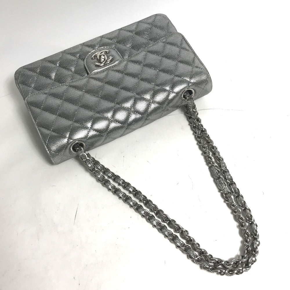 Silver quilted handbag with chain strap on a white background