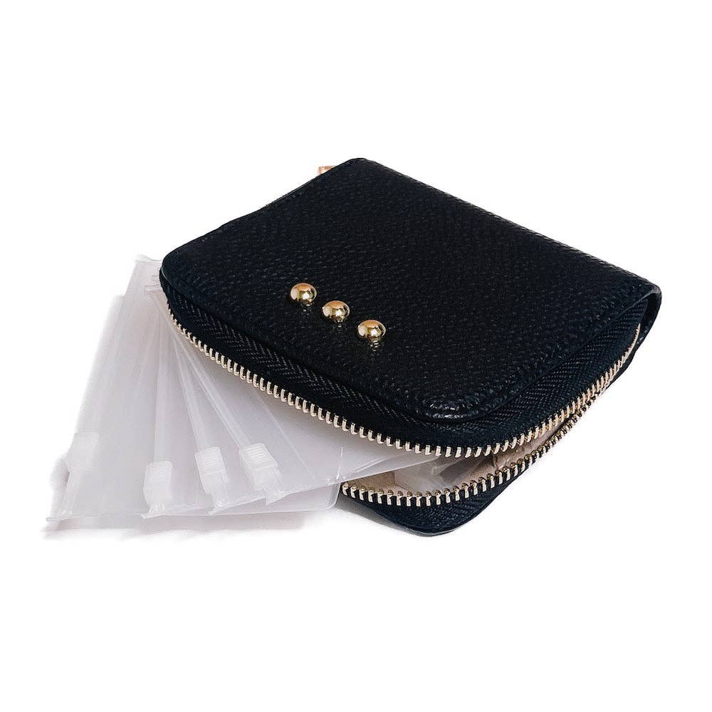 Black pouch with gold zippers on a white background