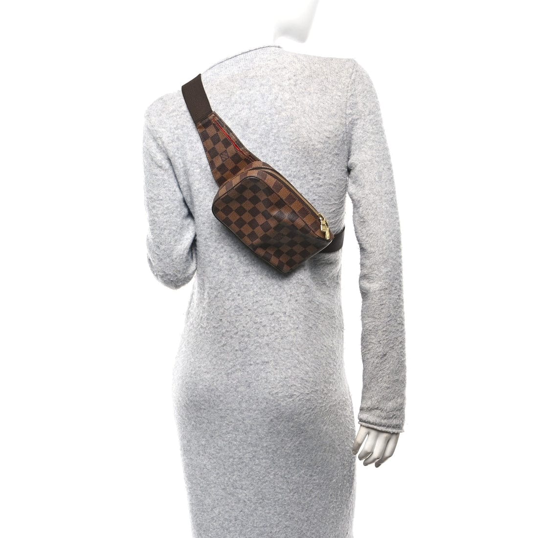 Mannequin wearing a gray dress with a brown checkered bag on a white background