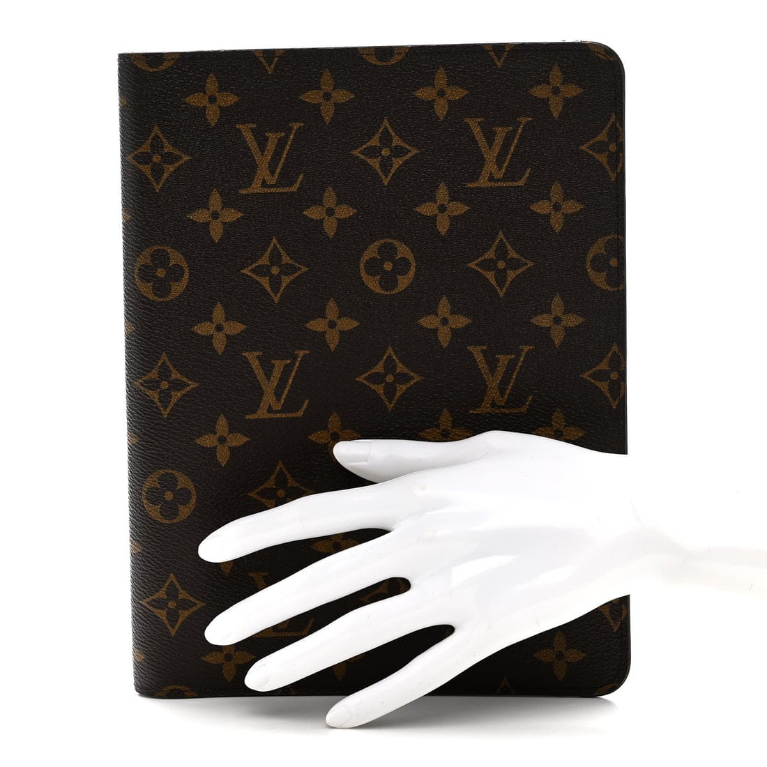 Louis Vuitton wallet with monogram pattern held by a white glove on a white background