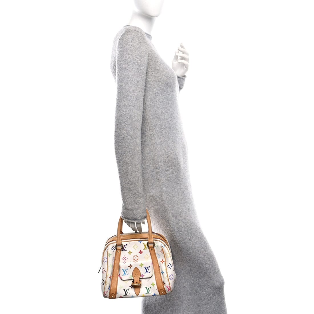 Mannequin wearing a gray sweater with a patterned handbag on a white background