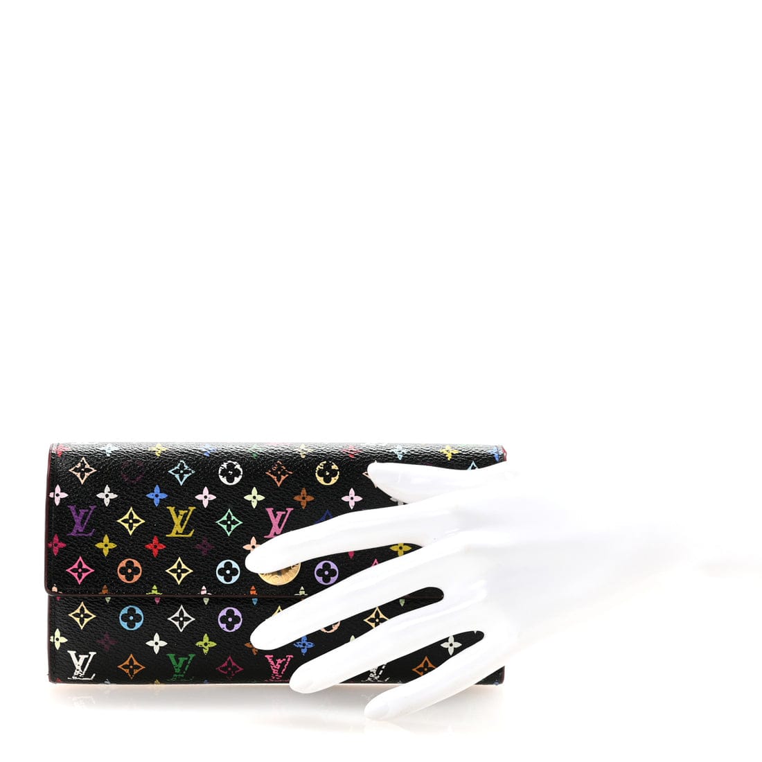 A Louis Vuitton monogram clutch bag in black coated canvas with multicolor monogram motifs, displayed on a white mannequin hand against a white background.