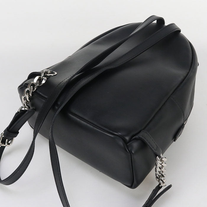 Black leather backpack with chain details on a white background