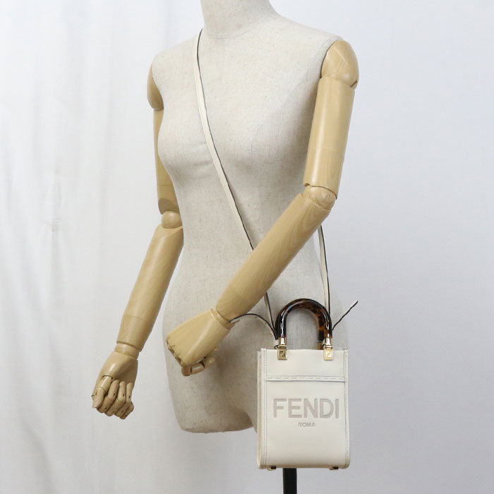 Fendi handbag held by a mannequin against a white background