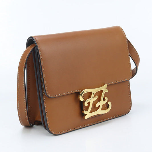 Brown handbag with gold logo on a white background