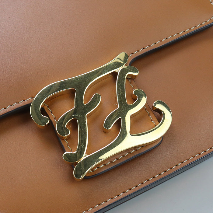 Gold 'FF' logo on a brown leather bag