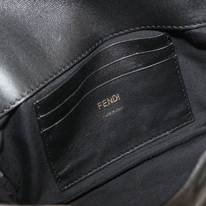 Black leather pouch with Fendi branding on a dark background