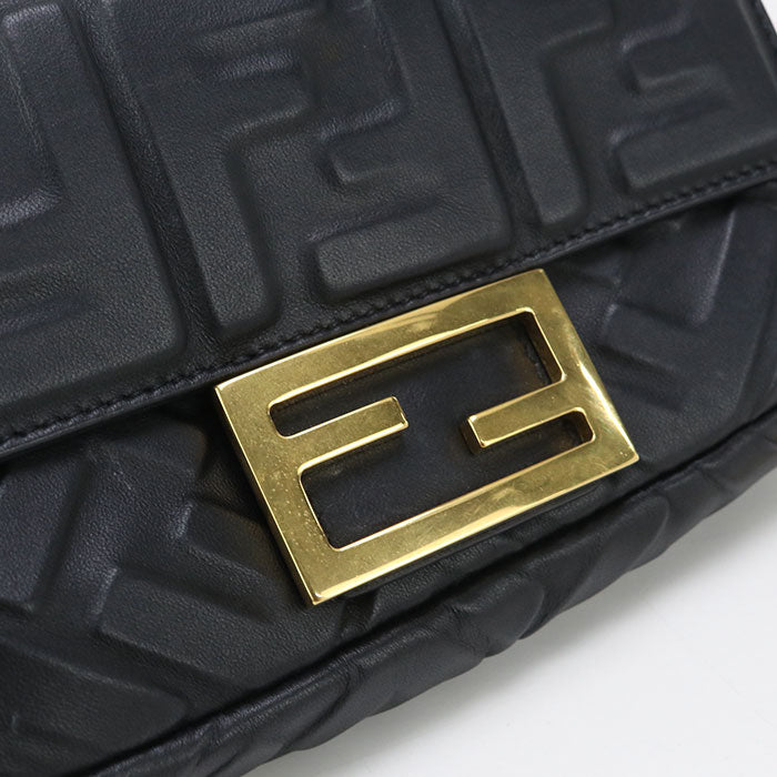 Black textured handbag with gold logo on a white background