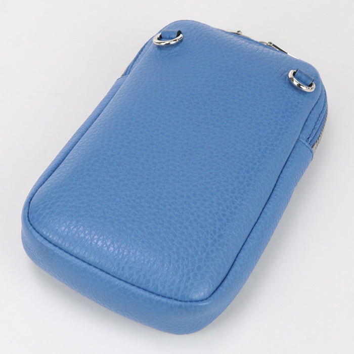 Blue textured pouch with silver zippers on a light gray background